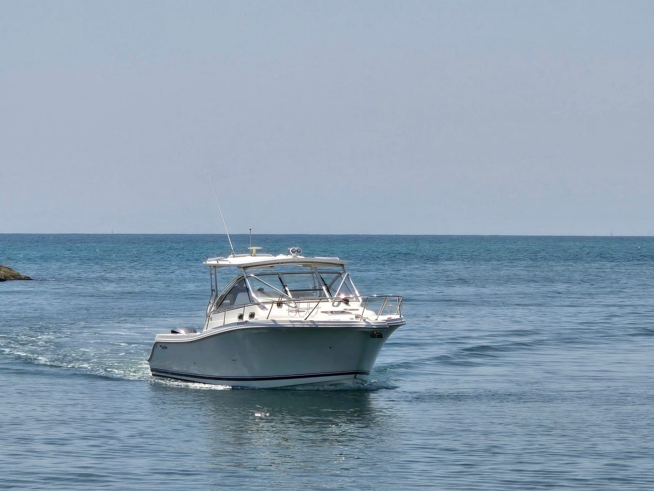 2013 Edgewater 335EX Express underway at sea, seen from the bow