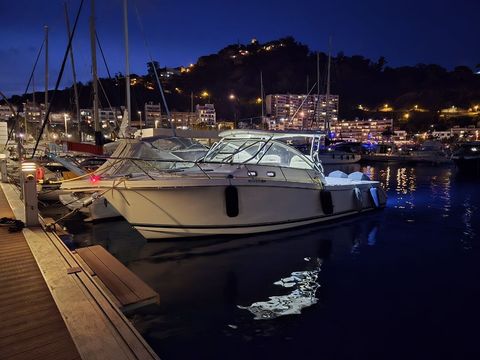 Edgewater 335EX Express at night in the marina